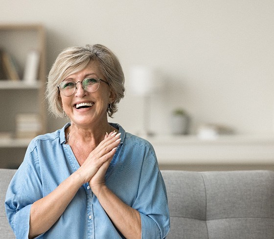 Older woman smiling with dentures