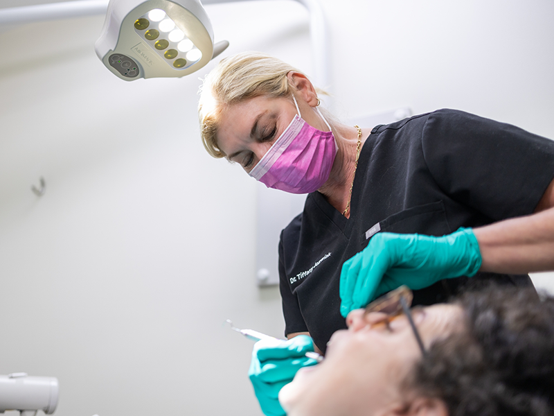 Dentist examining a patient's teeth