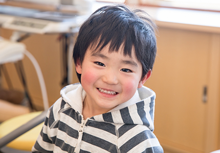 Young boy grinning