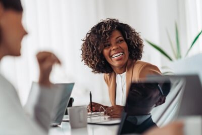 Female professional smiling confidently at work.